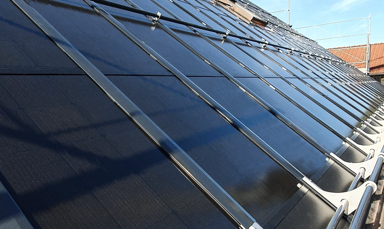 Illustration showcasing BIPV’s ultra-black solar panels in various applications.
